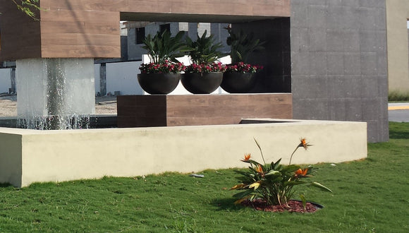 Round planters for beautifying buildings